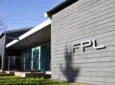 IFPL headquarters. A grey building with IFPL on the side of it.