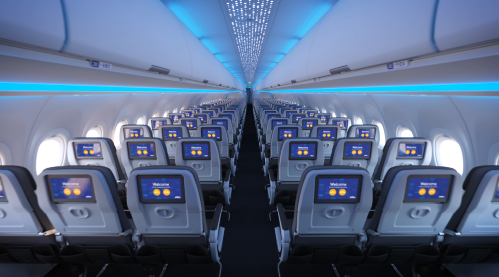 Jetblue economy cabin 3-3 configuration from the back showing embedded IFE