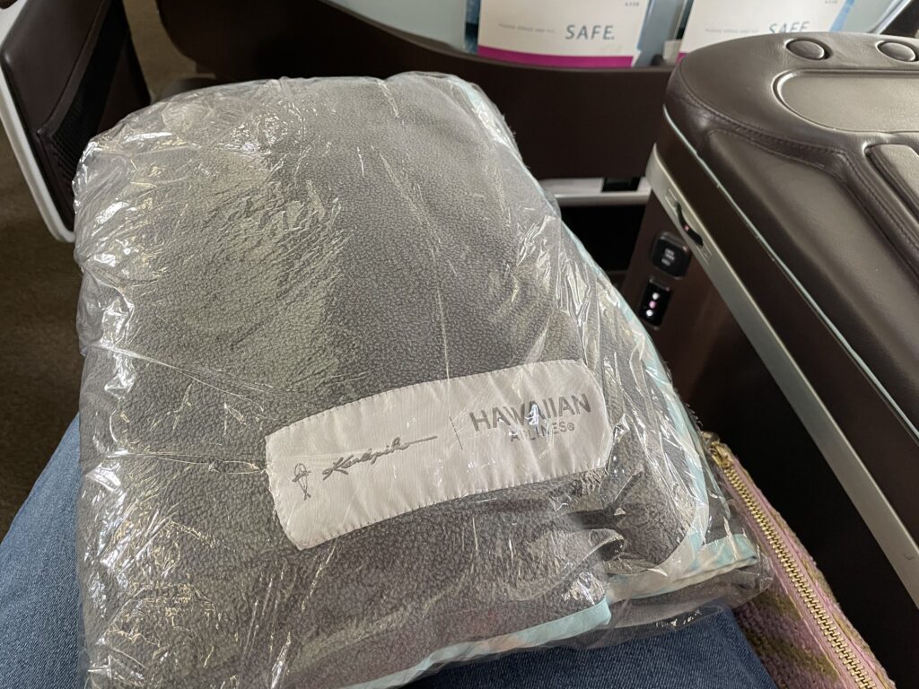 Bedding in packaging on the seat.