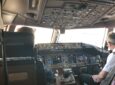 Two pilots in the cockpit of a Boeing 787