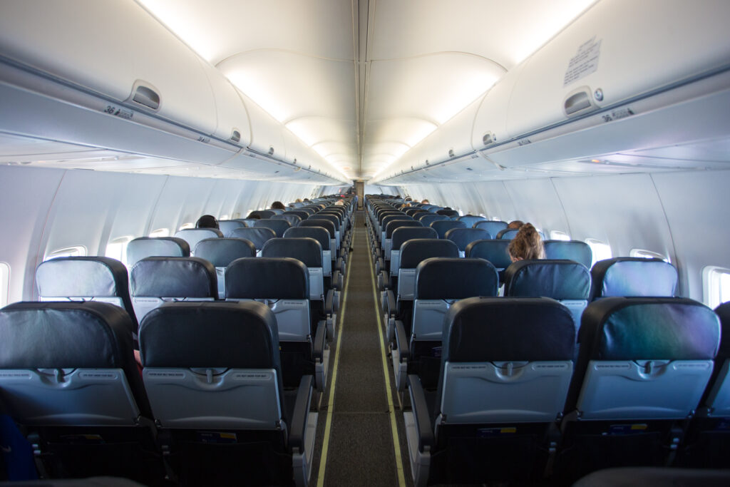 Avelo Boeing 737-800 interior in a 3-3 layout with blueish-grey seating.