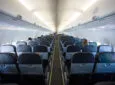 Avelo Boeing 737-800 interior in a 3-3 layout with blueish-grey seating.