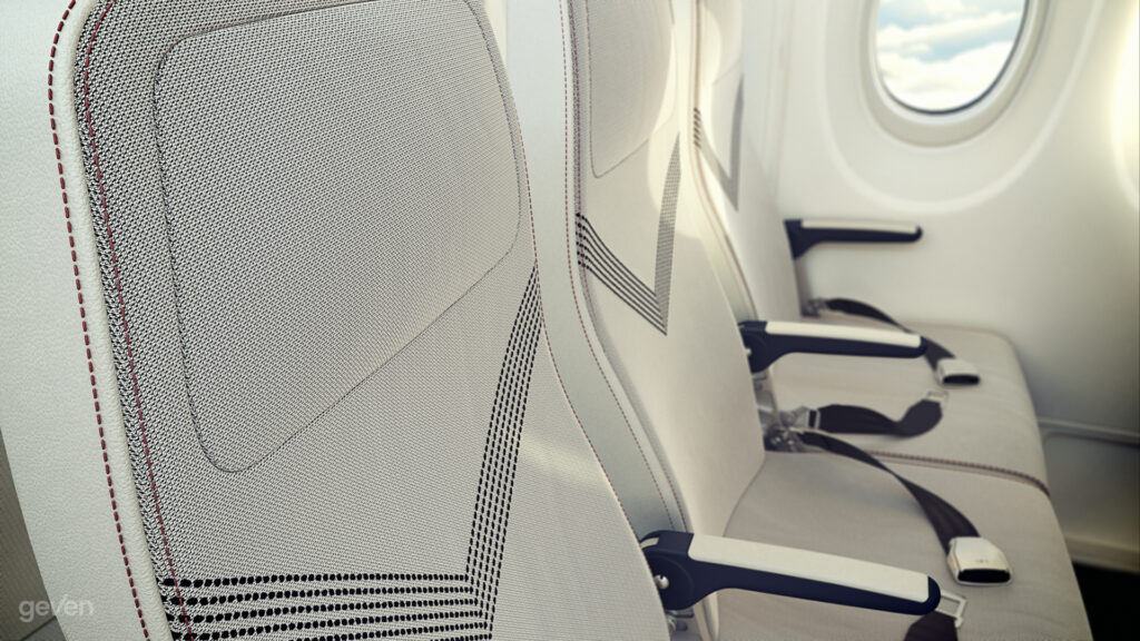 Close up of the Geven SuperEco seat. The seat is white with a grey V pattern design in the center.