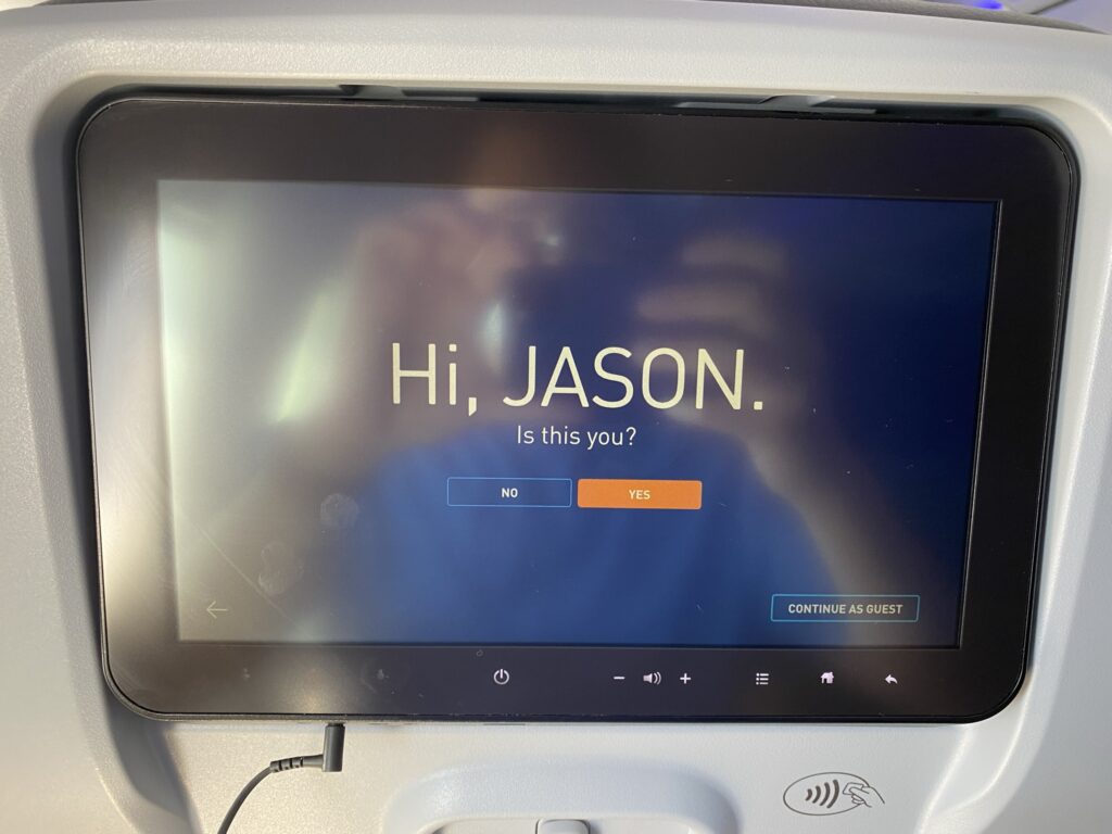 Thales Avant JetBlue seatback IFE screen. The display says "Hi Jason".