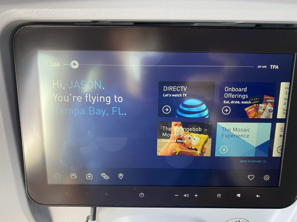 JetBlue's IFE system, showing a selection of DIRECTV, onboard food options, movies and more