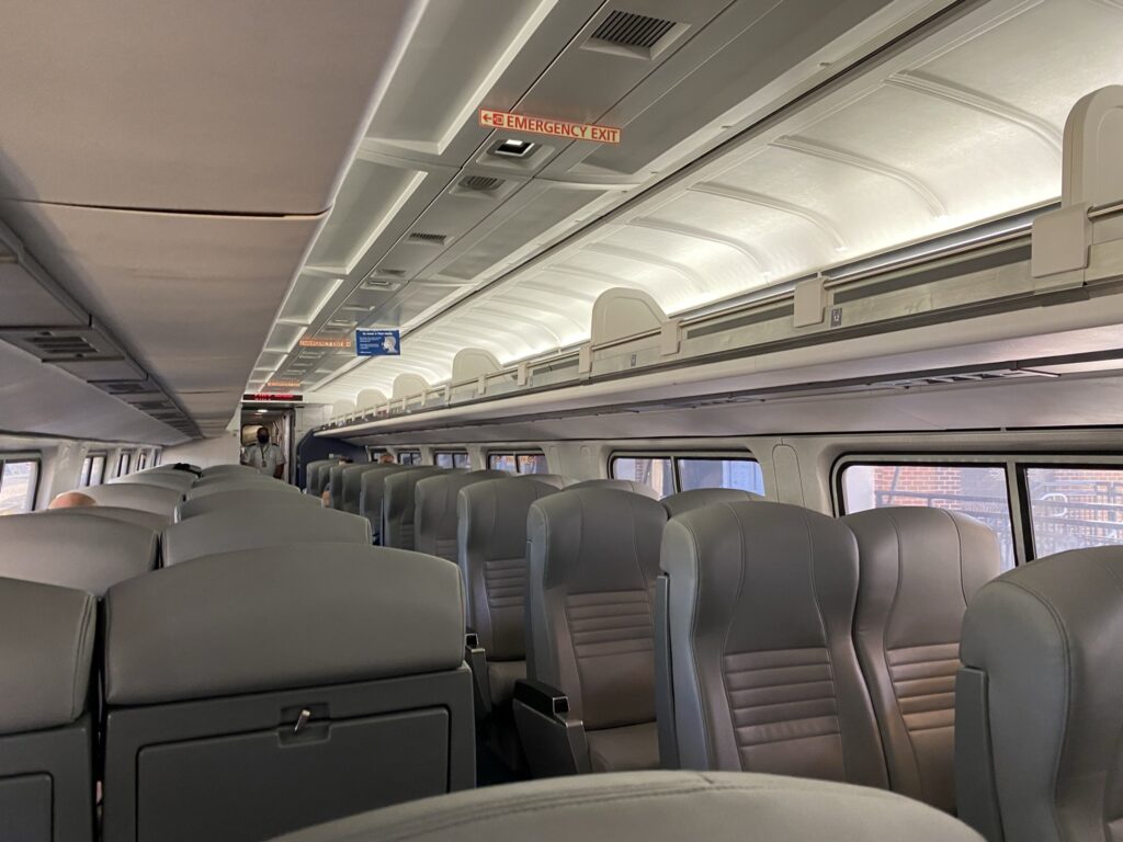 Amtrak rail car interior. Seating is all grey.