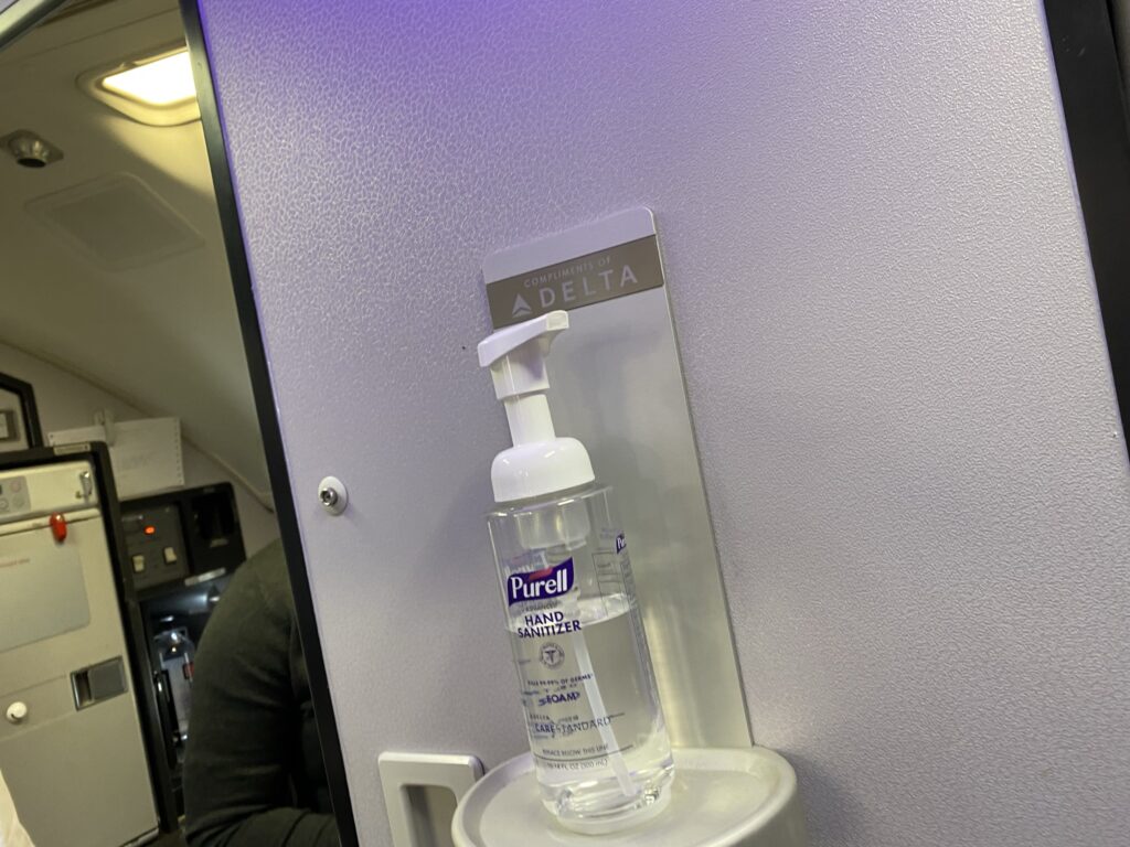 A hand sanitizer dispenser on board the Delta Boeing 737-900ER