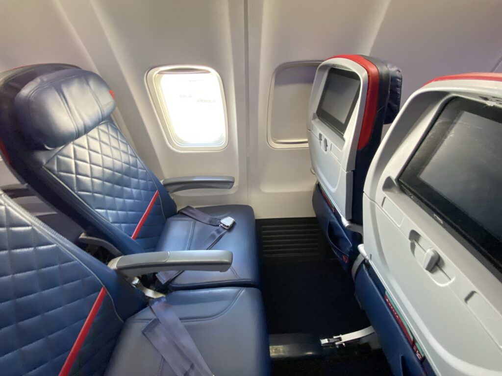 Blue seats and seatback IFE in the Comfort+ section on the Delta 757-200