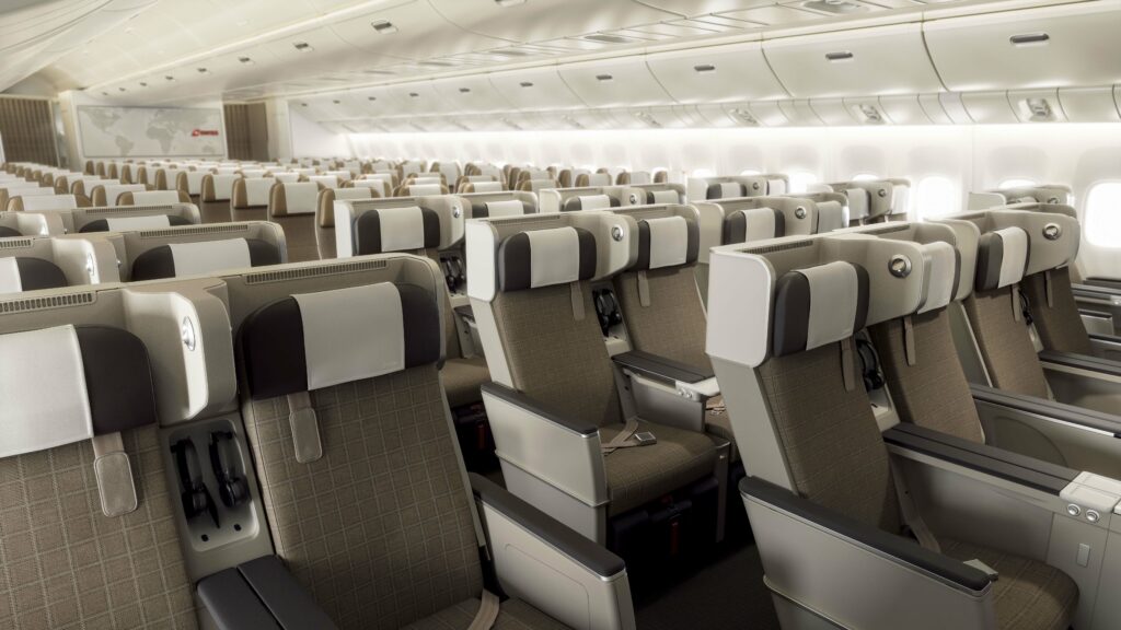 SWISS Premium Economy Class on a 777-300ER aircraft from a front angle view.