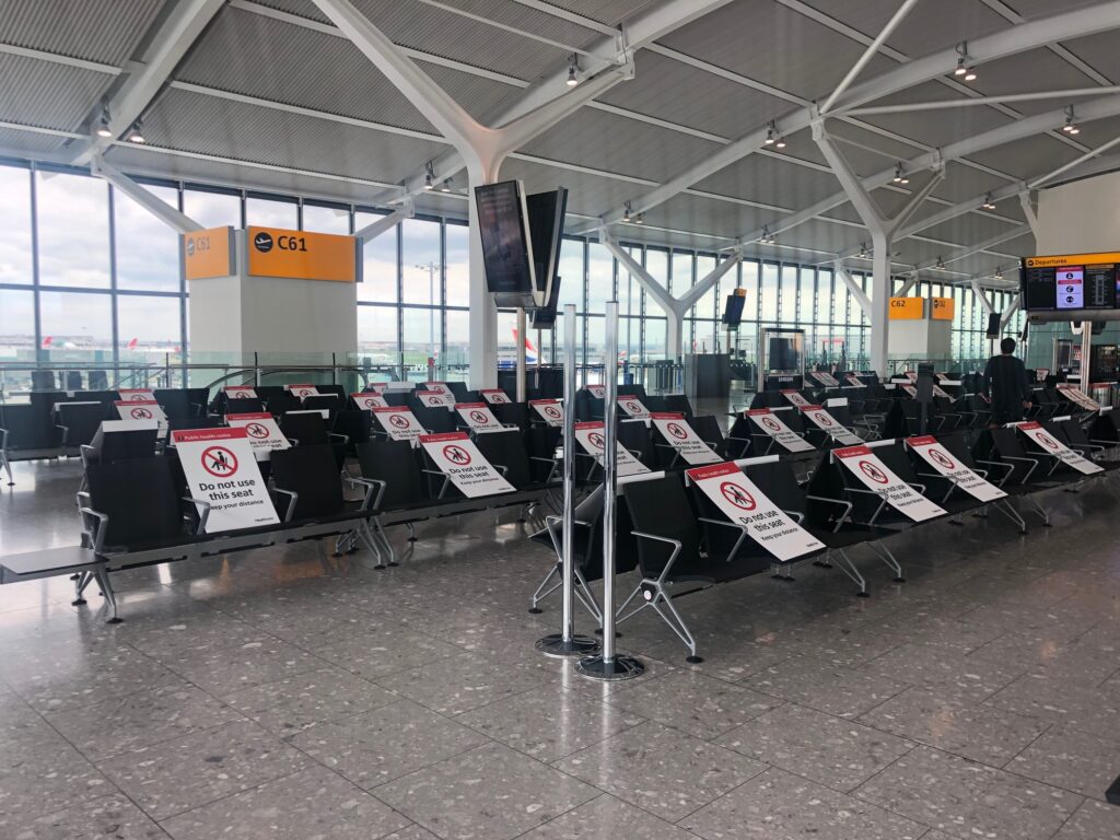 Airport with seats blocked off for COVID-19 social distancing