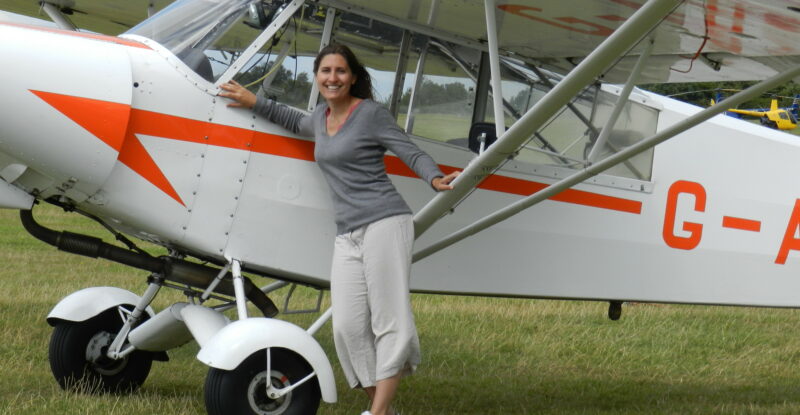 Susan Tuddenham is a Citation 560XLS first officer but has a passion for vintage aviation. Here she is with a Piper Super Cub glider tug. Image: Susan Tuddenham