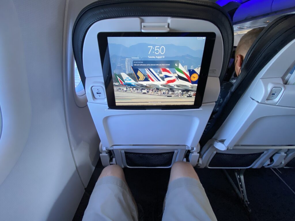 The author's iPad slots into the PED holder on the Alaska Airlines A321neo economy class seat.