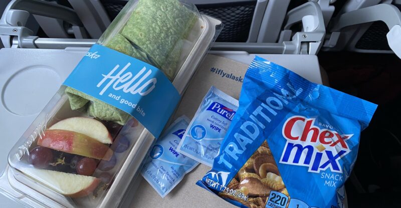 meal and CHEX MIX snack offered onboard Alaska Airlines