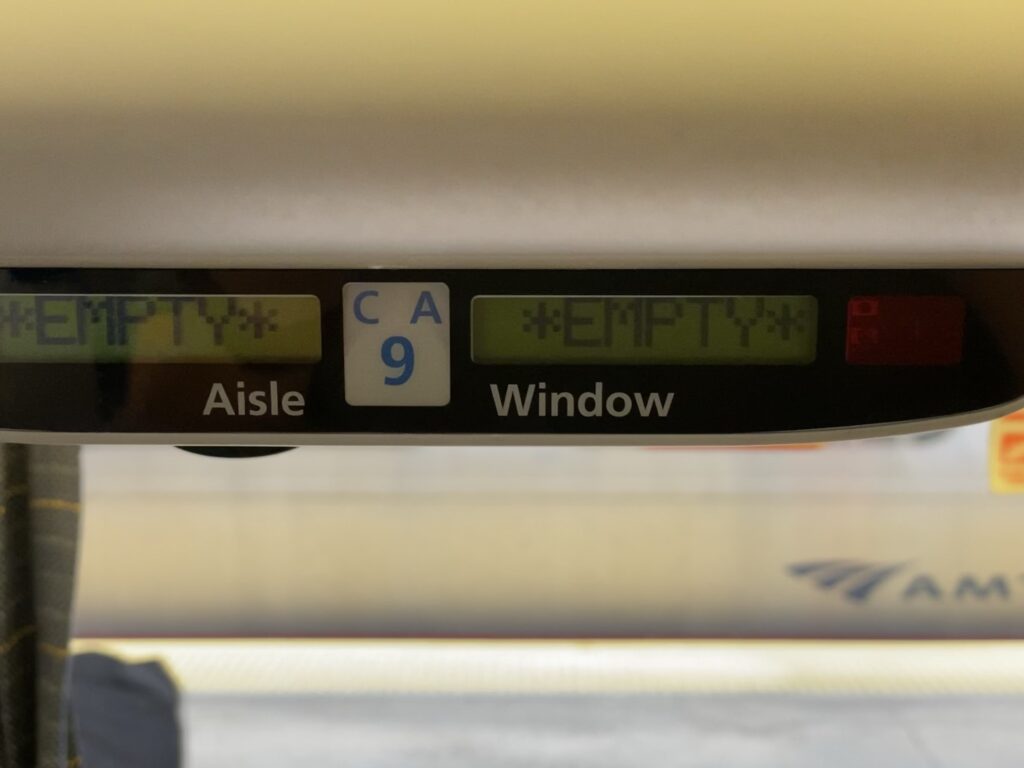 Seat display that reads the seat is empty on an Amtrak car.