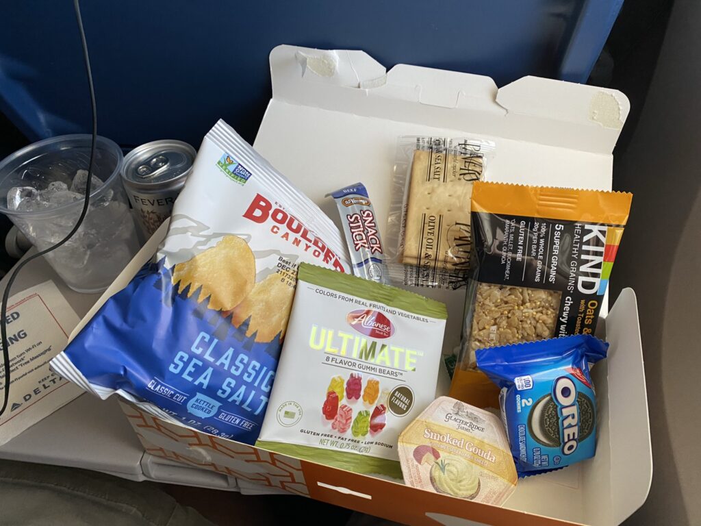 An assortment of snacks and treats in Delta's snack box