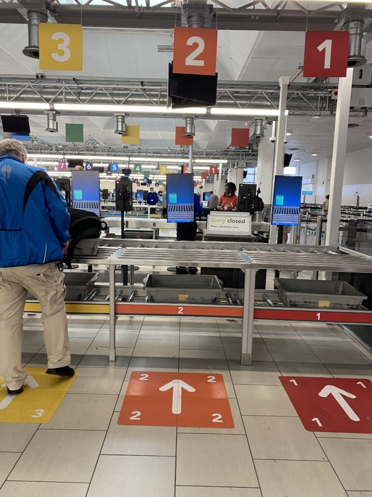 Passengers at security in Gatwick Airport.