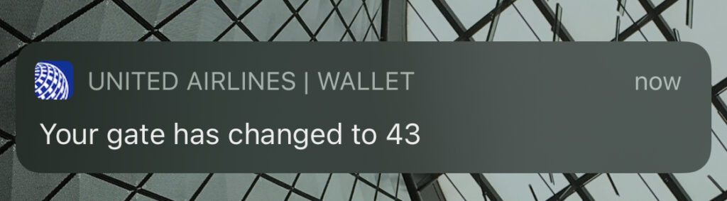 Notification on a mobile device saying "your gate has now changed to 43."