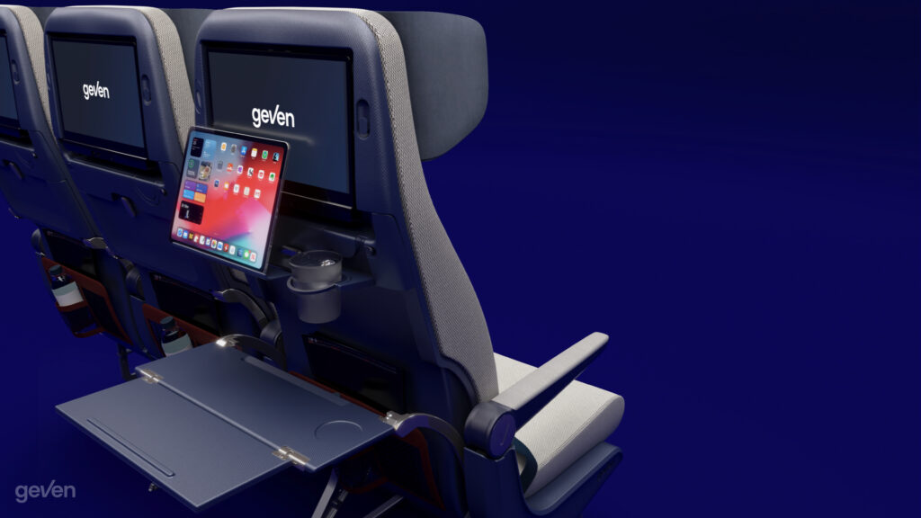 Tray table and PED holder for the Elemento Economy class seat by Geven rendered on a blue background.