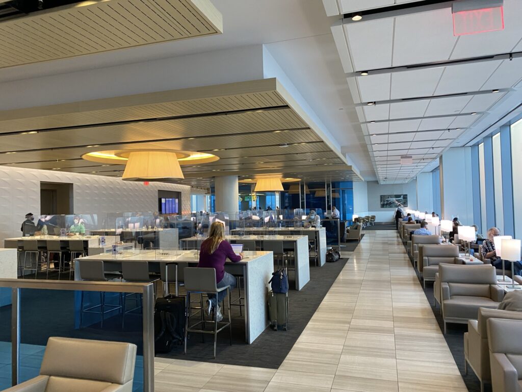 United Airlines' United Club Lounge in LAX with light streaming in from the windows