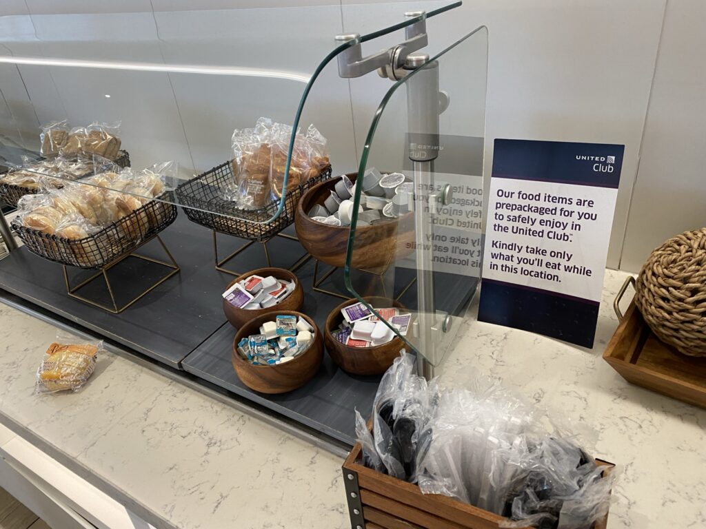 United Club breakfast bar with various packaged pastries 