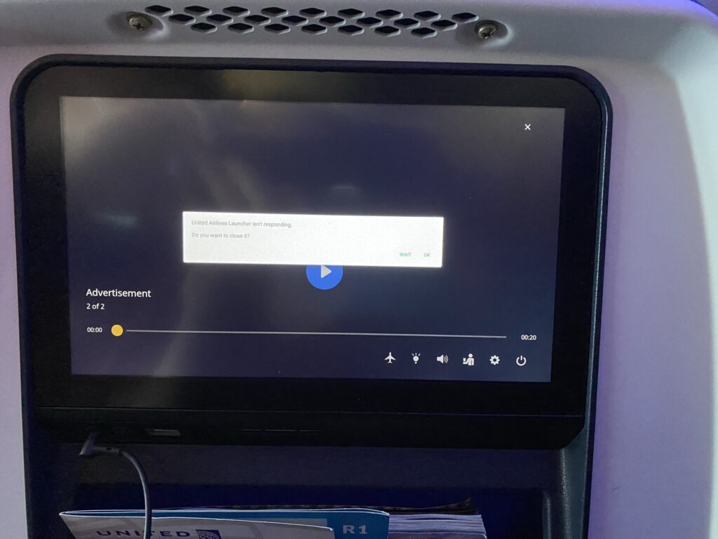 United Airlines Boeing 787-9 economy seatback IFE by Panasonic in locked mode.