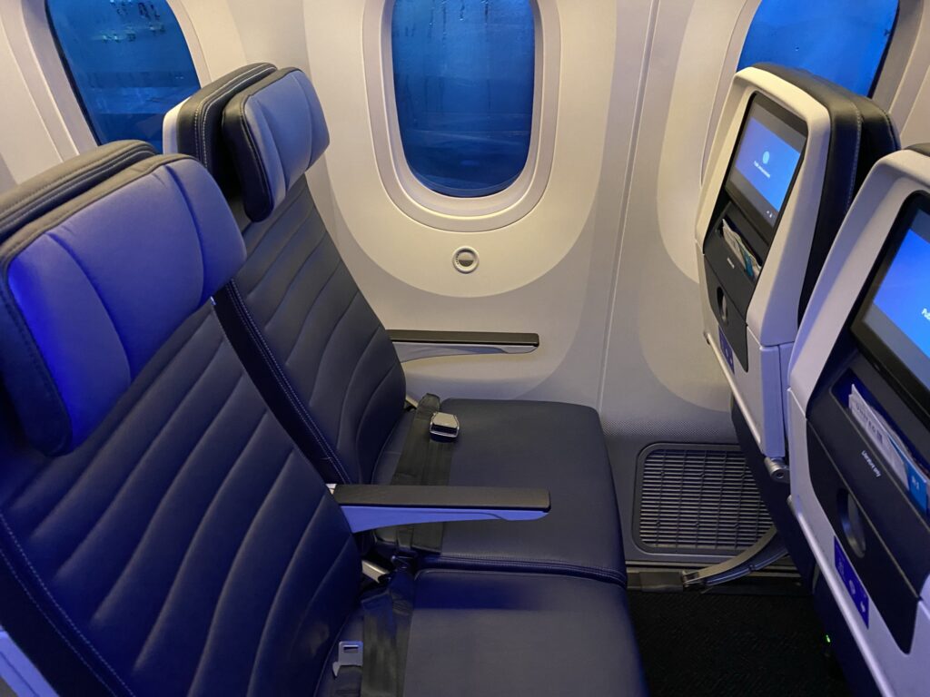 United Airlines' Boeing 787-9 economy class seats, with blue covers, and seatback IFE