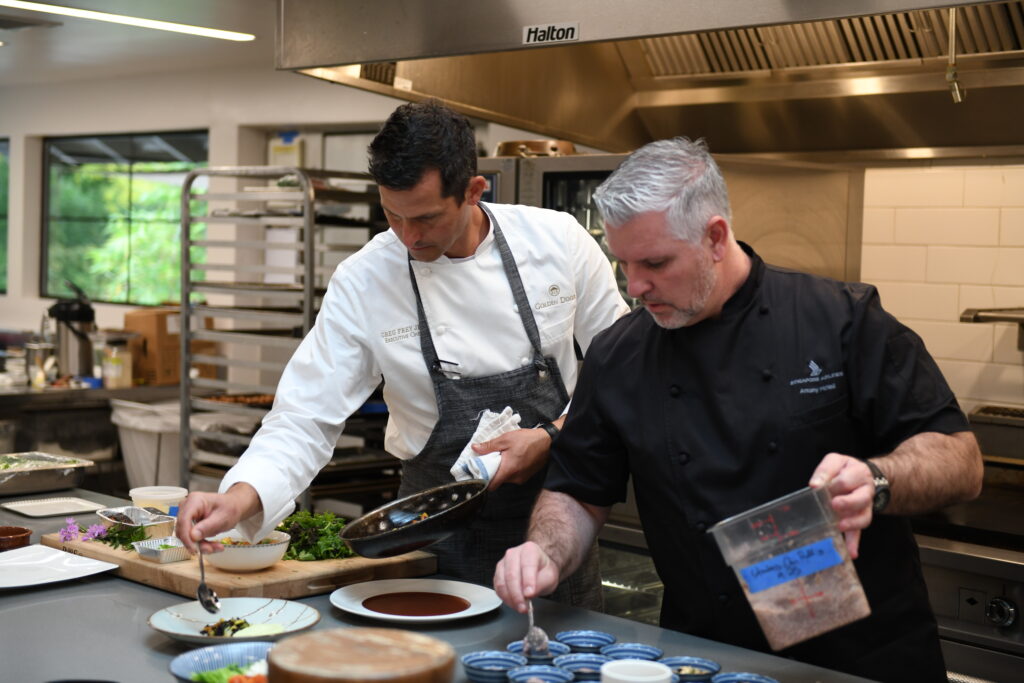 Golden Door Chefs preparing food in a kitchen.