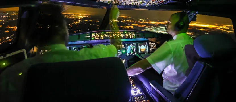 aircraft, pilots, crew, istock, generic, Night Flight A320 with Pilots Left Corner View Cockpit