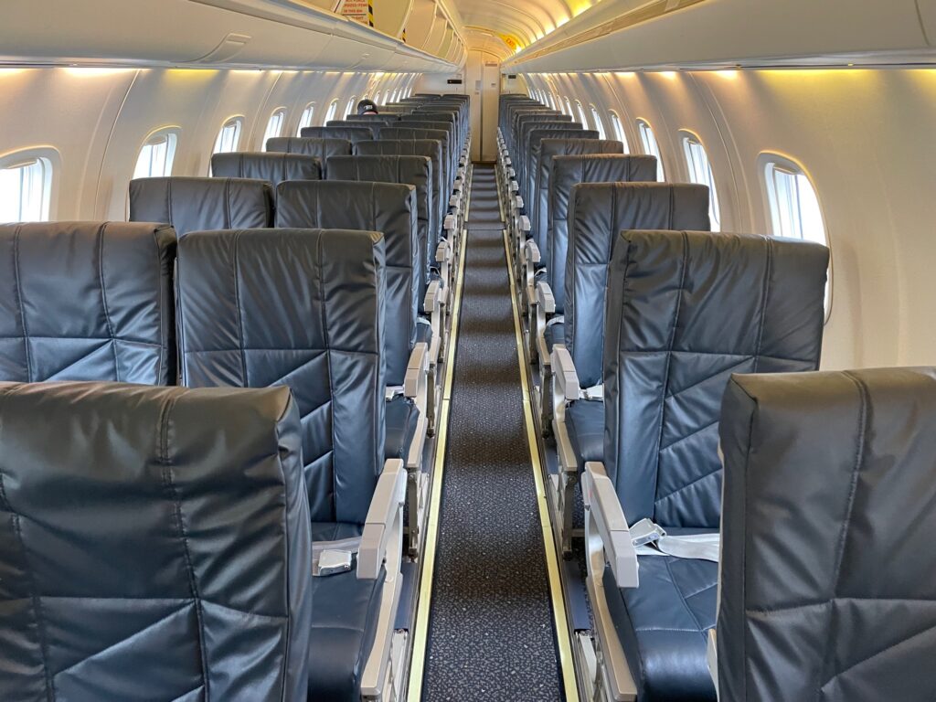 Inside the aha! E145 regional jet with a 2-1 seat layout