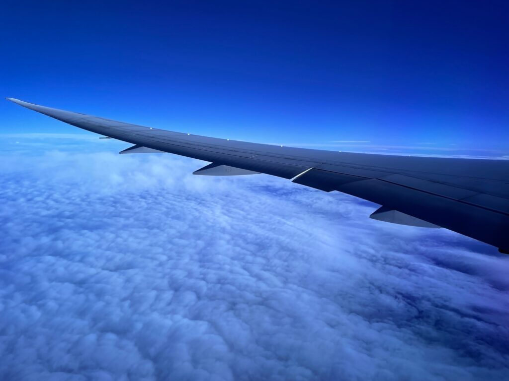 Wing of the 787, flying high above the clouds