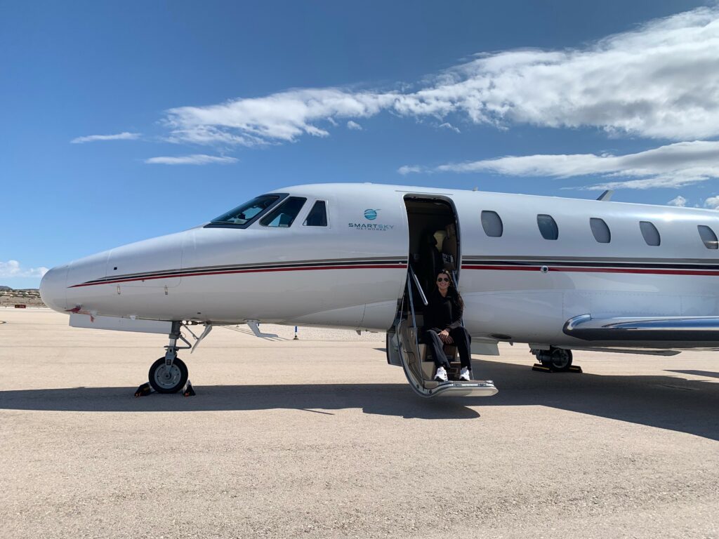 Caroline on the steps of the Citation jet