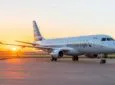 American Eagle/Envoy Embraer E175 at sunset.