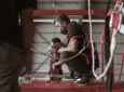 Two men working on ADE GX installs for AirAsia