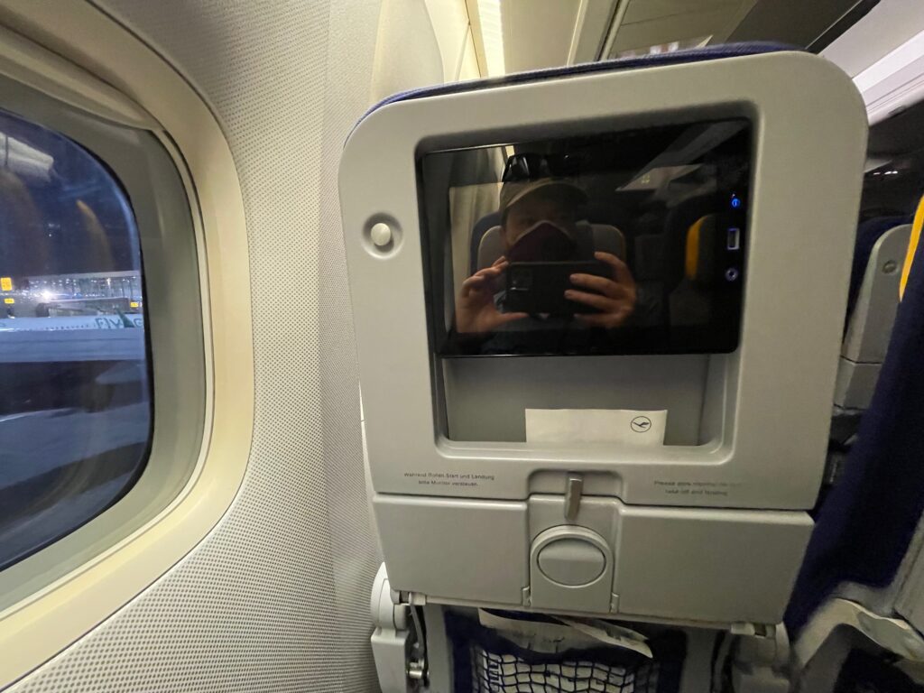 Lufthansa Boeing 747-400 economy class seatback and IFE screen. This is a window seat.