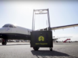 The RAY robot, sitting in front of an ATR turboprop on the tarmac
