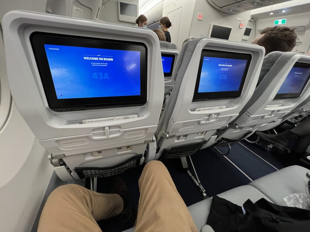 Finnair Airbus A350-900: legroom being demonstrated by the author in his seat.