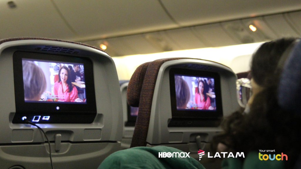 LATAM cabin showing Sex and The City on all of the seatback IFE