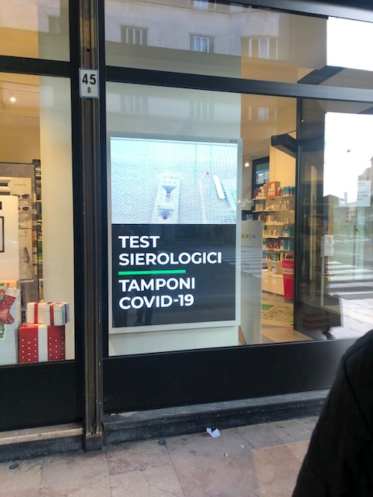 Sign in a window indicating a COVID testing center.