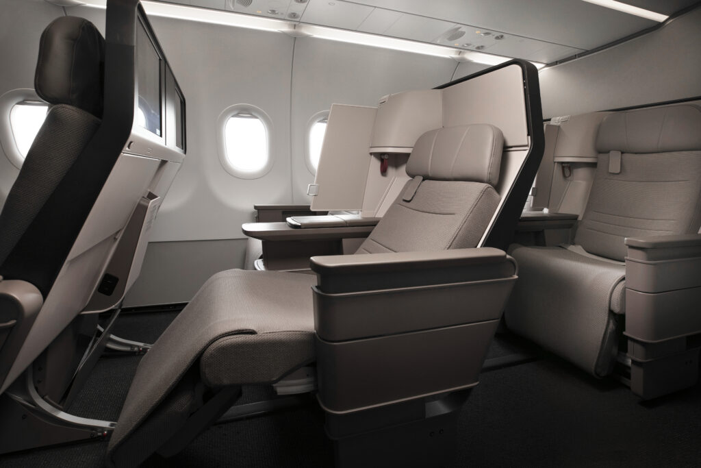 Cathay Pacific A321neo Collins' Air Rest Business class seat is pictured in tones of tan and brown.