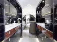Seen here is a sleek interior of a private business jet kitchen/galley.