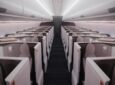 Computer generated image of Unum business class seats in an aircraft cabin. Ghostly like figures sit in the seats.