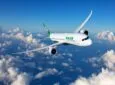 EVA Air Boeing 787-10 Dreamliner inflight over a body of water. Small white clouds scatter a blue sky.