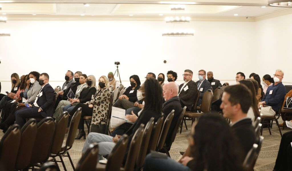 A variety of people listening to speakers that attended the LAX Business Inclusivity Networking Event 