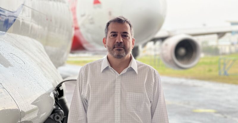 Nikos Gitsis standing next to an A320 at Dornier Technology heavy maintenance base at Clark