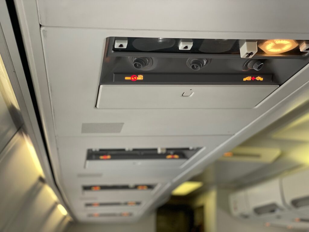 The passenger service units aboard Air North, featuring light buttons and flight attendant call button