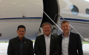 L to R Satcom Direct’s John Kummer, VP Strategy & Programs, Jim Jensen Founder and CEO, and Chris Moore, President, celebrate STC approvals for the Plane Simple terminal on Gulfstream types. 