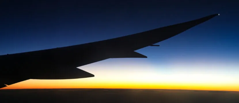 Beautiful view of Dreamliner plane wing flying into the darkness / last parts of sunset enroute to Brazil. Iris