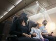 Pexco Air Shield concept image. A family is sitting masked and there are streams of air coming down around the family.
