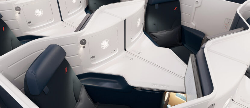 Business Class center pair seats on Air France Boeing 777-300ER. The cabin is a 1-2-1 configuration of blue seats with white thermoplastic shells.