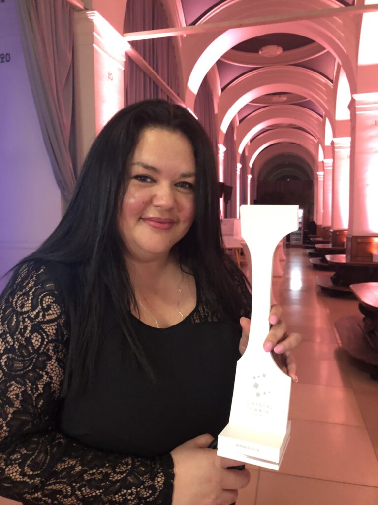 Corinne Streichert is pictured here holding the Crystal Cabin Award for IFEC in 2019